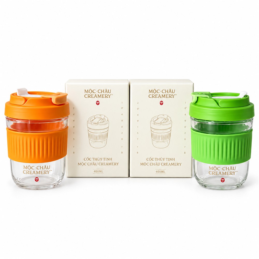 Branded glass cups with silicone lids and gift boxes — an example of a promotional gift for dairy brands (Moc Chau Creamery).