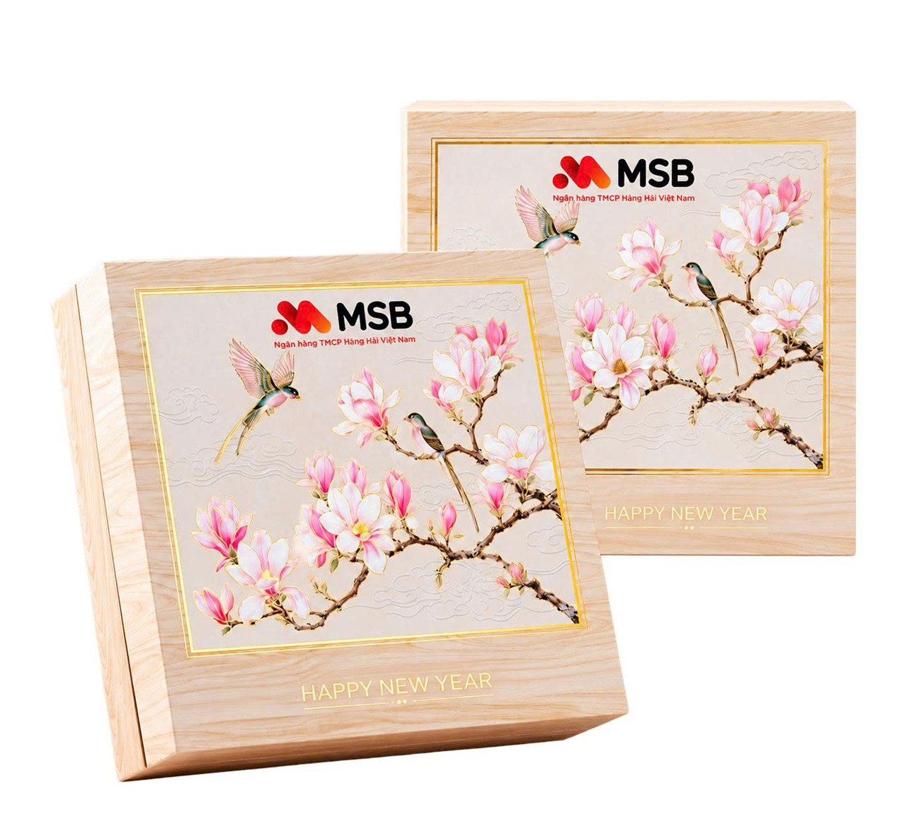Tet gift boxes with magnolia and bird artwork, MSB logo and Happy New Year lettering