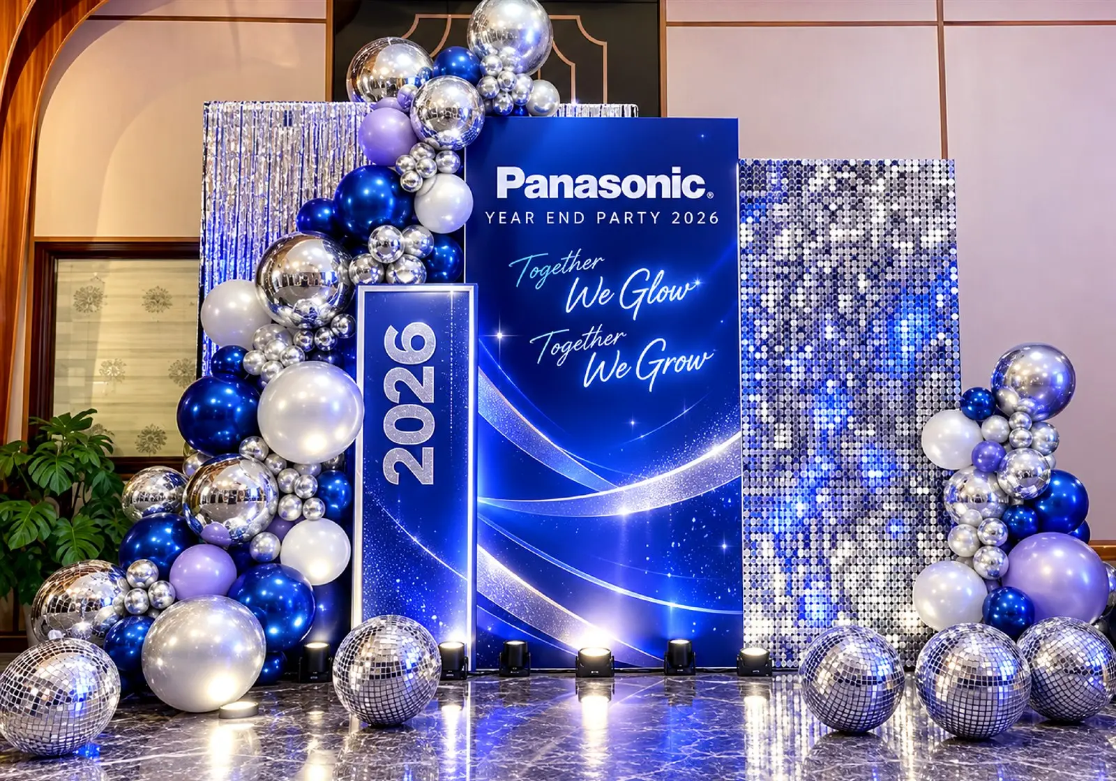 Balloon backdrop with silver sequin panels and a year column from the Panasonic Year End Party proposal