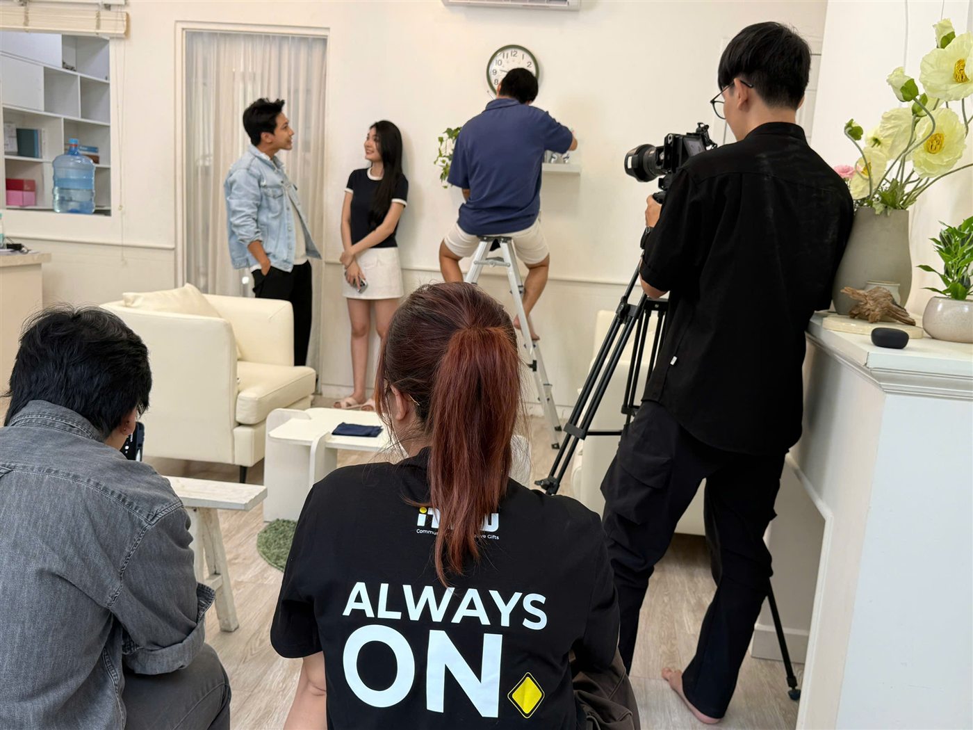 Now's crew batch-shooting several AUX short videos in the same living-room set