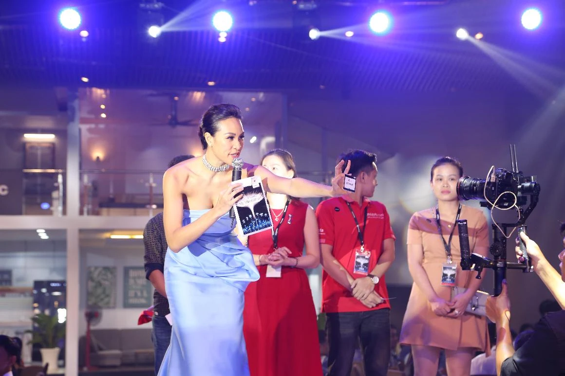 MC leading interaction with dealers while a camera crew films live at the Panasonic conference